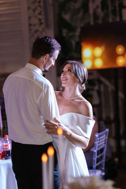 istock the first dance of the bride and groom inside a restaurant 1474405301