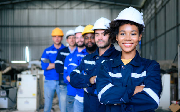 istock Group of confident worker team at factory 1474408382