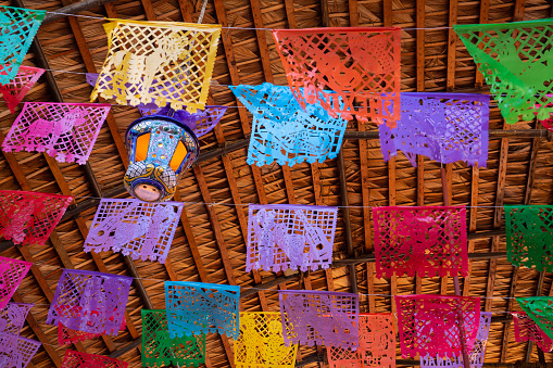 Colorful Mexican fiesta  decorations hang in a restaurant