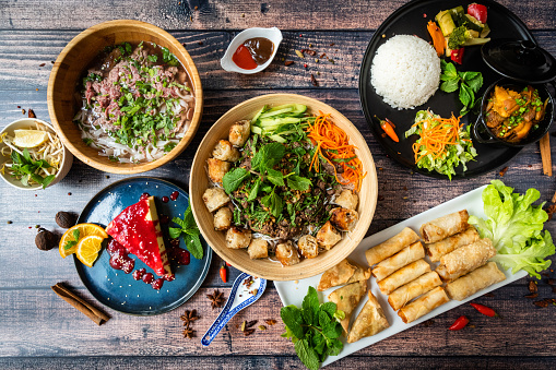 Mixed and tasted asian food on a wooden tablefood