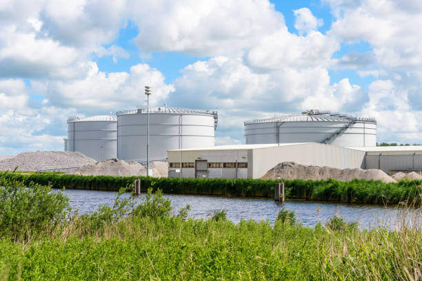 Biomass digesters in a biogas plant along a canal