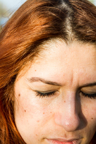 istock Sad Woman With Eyes Closed 1474412011
