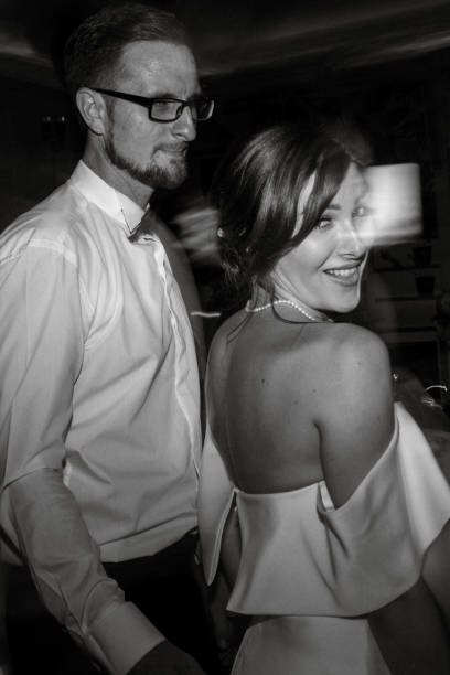 the first dance of the bride and groom inside a restaurant with heavy smoke