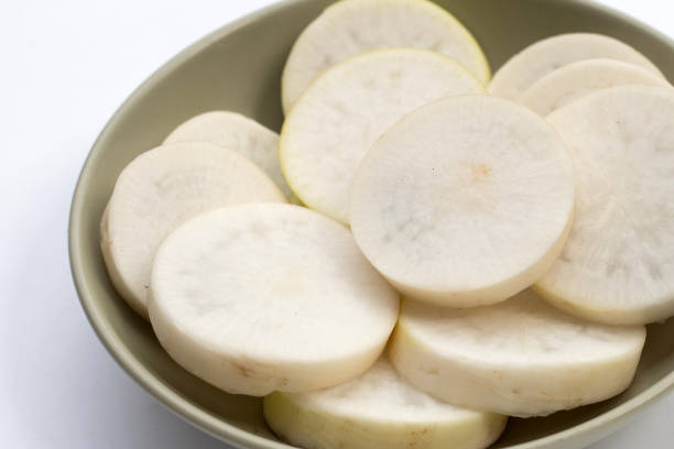 istock Sliced Japanese daikon. Fresh vegetables 1474412824