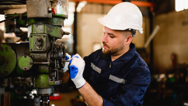 istock Professional male technician checking and repairing machinery 1474413794