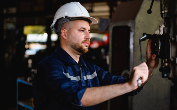 istock Professional male technician checking and repairing machinery 1474414934