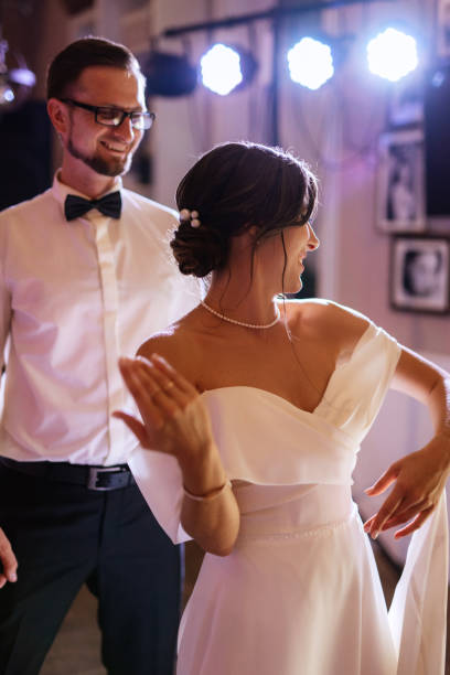 istock the first dance of the bride and groom inside a restaurant 1474415061