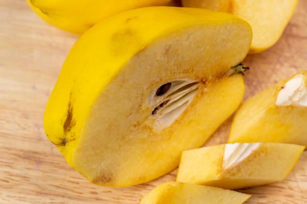 istock Sliced ripe yellow quince on a cutting board 1474416047