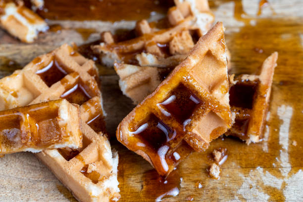 istock Soft fresh waffles with bee honey close-up 1474416123