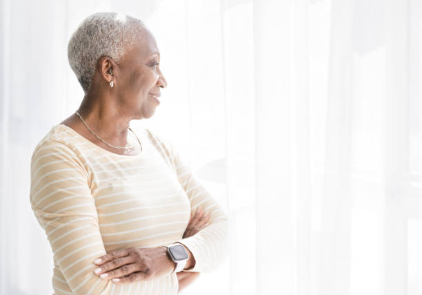 istock Senior Black Woman Thinking by the Window 1474426890