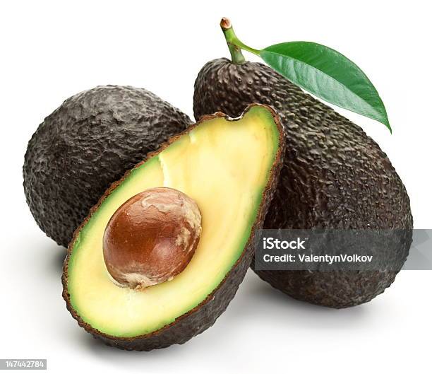 Two Whole Avocados With Leaves And One Half Stock Photo - Download Image Now - Hass Avocado, Avocado, White Background