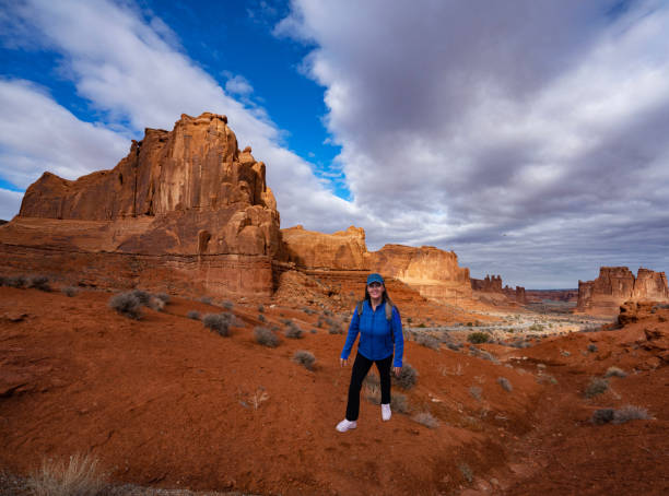 istock Smiling woman relaxing on hiking trail. 1474428888