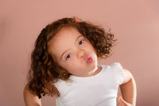 Beautiful red-haired little girl posing for the camera.