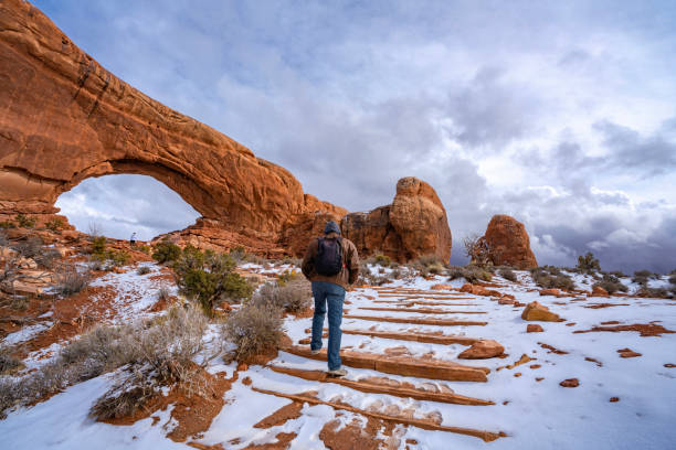 istock Man hiking in red mountains in Utah. 1474433093