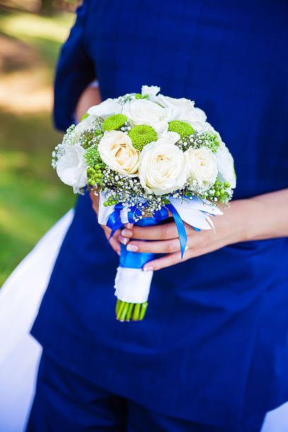 istock bride and groom. Happy bride and groom on their wedding hugging. 1474437618