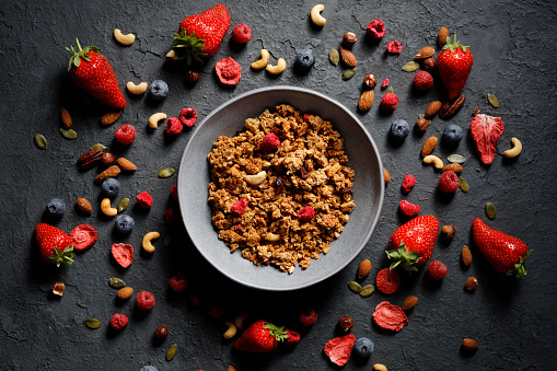 Rustic photography of organic granola with different lyophilized ingredients