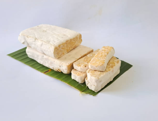istock fresh tempeh isolated on white background, indonesian food 1474441451