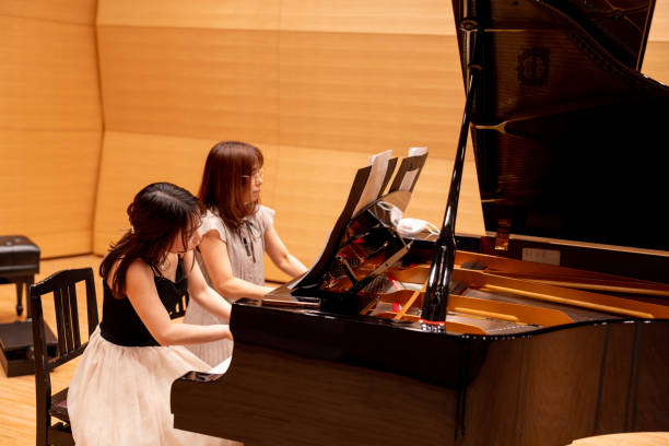 istock Piano duet by mother and daughter 1474442224