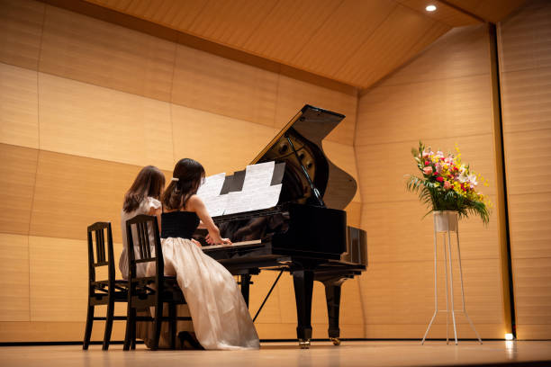 istock Piano duet by mother and daughter 1474442268