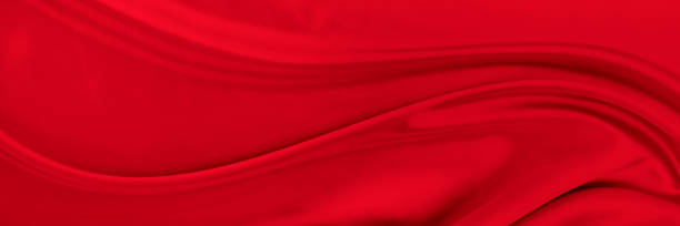 istock Black red satin dark fabric texture luxurious shiny that is abstract silk cloth background with patterns soft waves blur beautiful. 1474443015