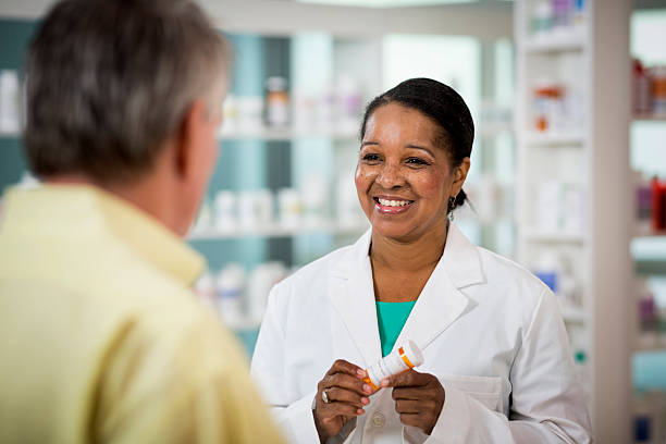 Prescription Senior man picking up prescription research ethics stock pictures, royalty-free photos & images