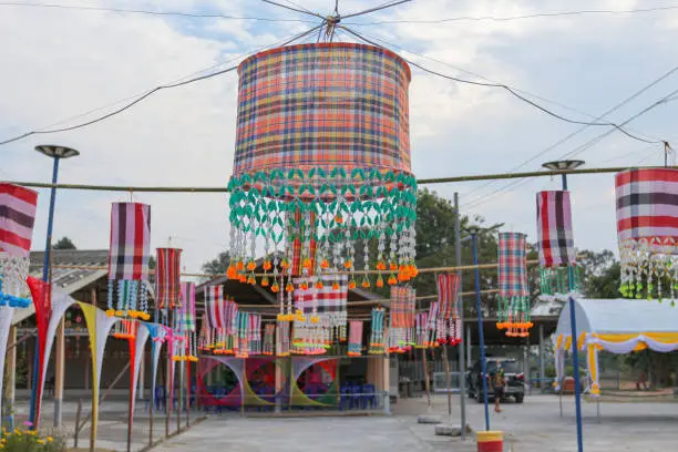 Photo of An ancient merit-making tradition using objects and flags decorated according to religious beliefs.