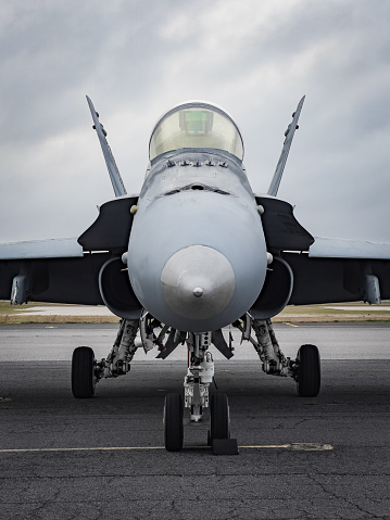 A legacy Boeing F/A-18 Hornet fighter jet sits on the ramp at KPNS before heading to Utah to get scrapped.