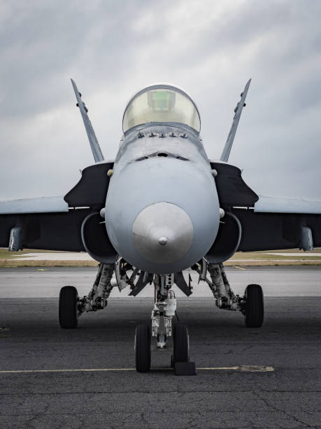 Legacy F/A-18 Hornet Fighter Jet A legacy Boeing F/A-18 Hornet fighter jet sits on the ramp at KPNS before heading to Utah to get scrapped. military airplane stock pictures, royalty-free photos & images