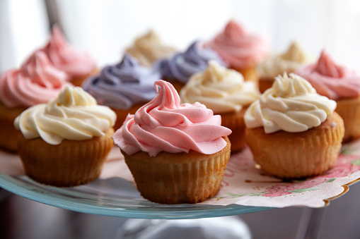 Organic homemade colorful cupcakes served on the plate for Birthday party in a selective focus - Image