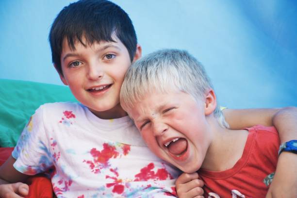 istock Two Boys in a Tent on a Camping Trip 1474479213