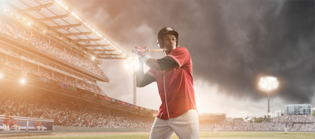 professional baseball player holding bat waiting for ball in floodlit outdoor stadium under stormy sky