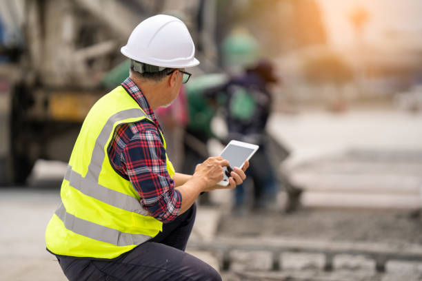 istock Male engineer in charge of road construction in the construction site 1474481824