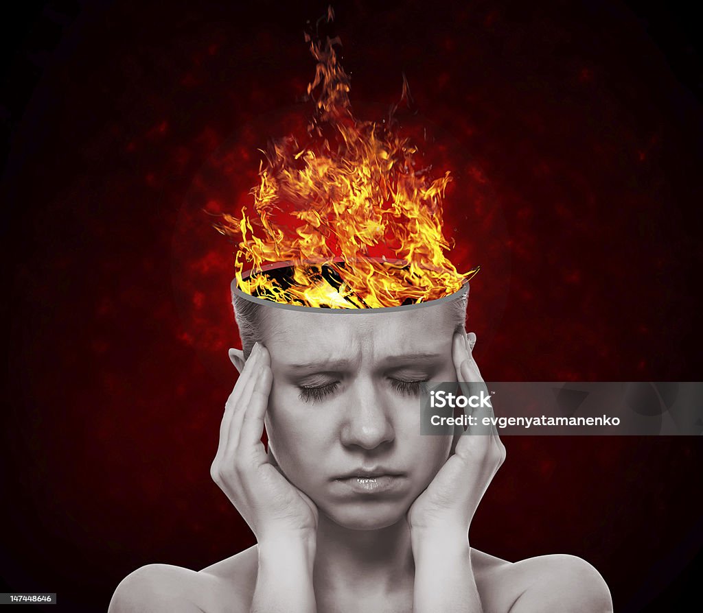 woman with flame of fire concept, an idea.  head of woman with a flame of fire on black background Concepts Stock Photo