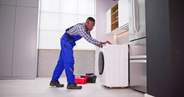 istock Young Man In Overall Repairing Washing 1474487009