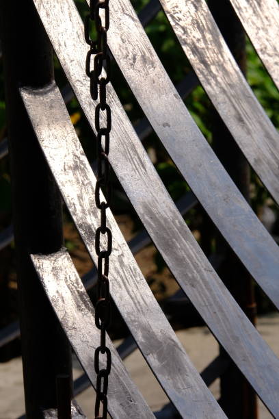 istock a bench on a fence in the city 1474490998