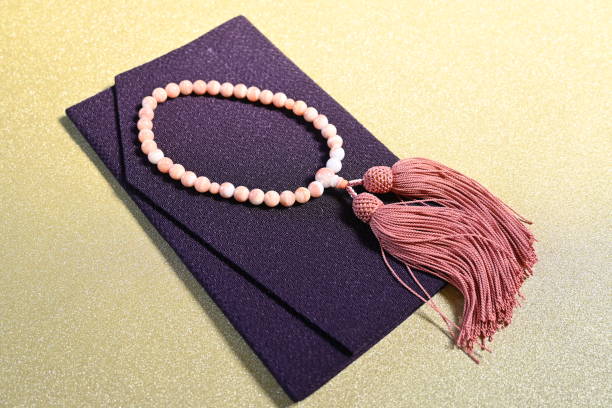 istock Funeral rose quartz prayer beads and money envelopes 1474494943