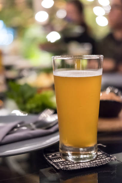istock Glass of beer with blur background 1474495170