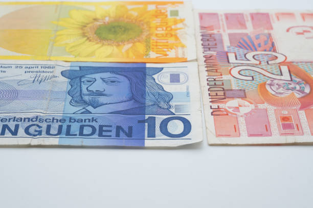 Dutch Paper Money Dutch paper money. 10, 25 and 50 guilder bills. Free space in the foreground. dutch guilders stock pictures, royalty-free photos & images