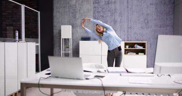 istock Arms Stretch Exercise Standing Near Desk 1474498578