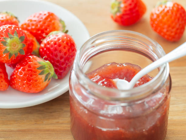 istock Strawberry jam and fresh strawberries 1474500377