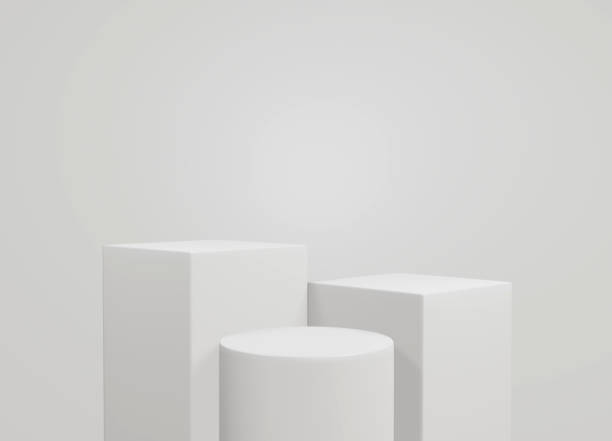istock empty white podium.3D display podium on white background.Stand Minimal mockup for presentation.Abstract white background concept.Geometric platform show cosmetic product.Stage showcase.3D rendering 1474502183