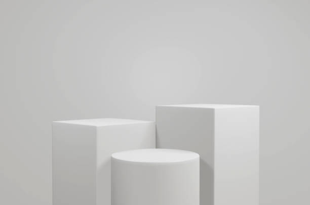 istock empty white podium.3D display podium on white background.Stand Minimal mockup for presentation.Abstract white background concept.Geometric platform show cosmetic product.Stage showcase.3D rendering 1474502187