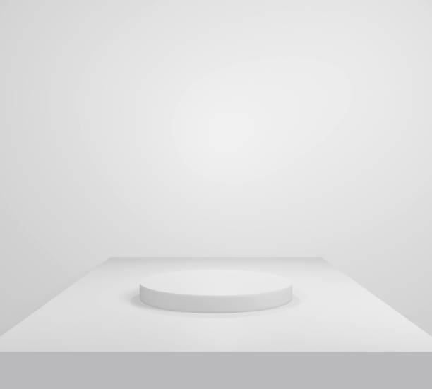 istock empty white podium.3D display podium on white background.Stand Minimal mockup for presentation.Abstract white background concept.Geometric platform show cosmetic product.Stage showcase.3D rendering 1474502560