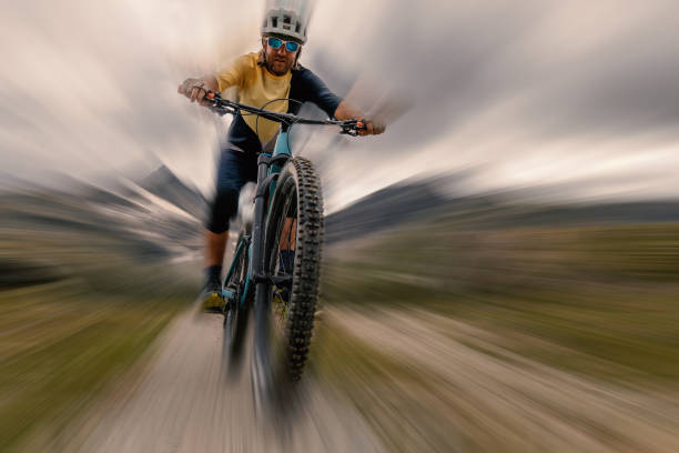 istock Close-Up blurred motion, mountain biker descending trail 1474506877
