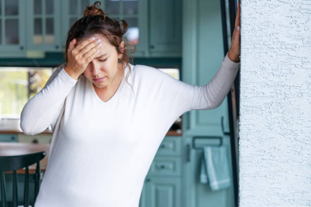 istock Young woman suffering from vertigo or dizziness problem of brain or inner ear 1474506899