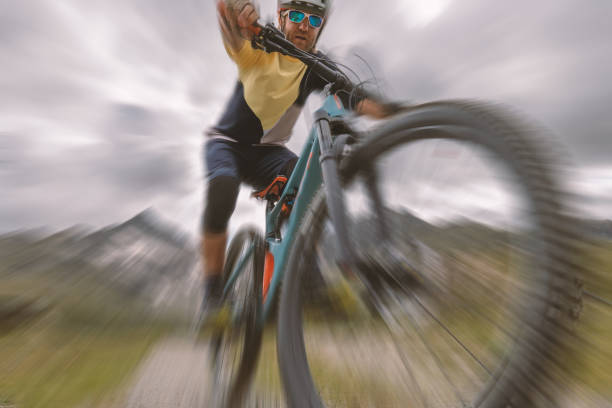 istock Close-Up blurred motion, mountain biker descending trail 1474508914