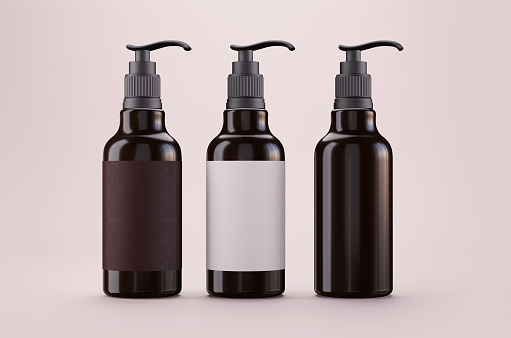 Transparent brown bottles mockup for cosmetic on pink background
