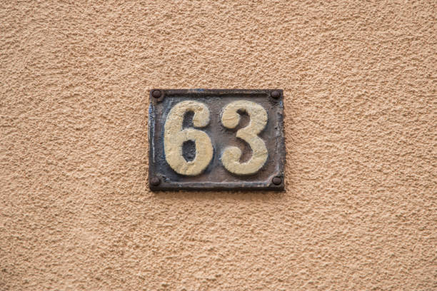 istock Old retro cast iron plate number 63 1474510705