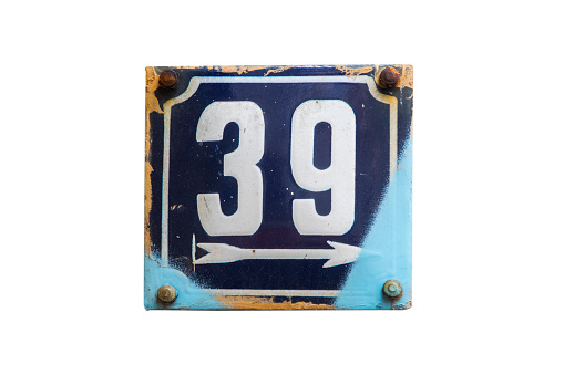 Weathered grunge square metal enameled plate of number of street address with number 39 isolated on white background