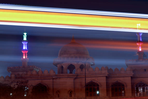 istock Light trails with Tomb in background 1474511839